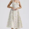 Adabella Hellblaues Baumwoll-Halter-Sommerkleid mit Wiesenblumen-Print Adabella Hellblaues Baumwoll-Halter-Sommerkleid mit Wiesenblumen-Print