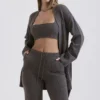 Alaia Strickjacke aus Kaschmirmischung in Anthrazit mit Gürtel Alaia Strickjacke aus Kaschmirmischung in Anthrazit mit Gürtel