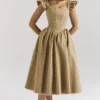 Alessandra Midi-Kleid aus goldenem Jacquard mit abnehmbarem Schleifen