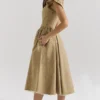 Alessandra Midi-Kleid aus goldenem Jacquard mit abnehmbarem Schleifen