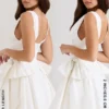 Amalia Weißes Minikleid aus Stretch-Baumwolle mit Schleifen Amalia Weißes Minikleid aus Stretch-Baumwolle mit Schleifen