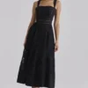 Ava Schwarzes Midi-Kleid aus Baumwolle mit Broderie-Anglaise-Applikationen Ava Schwarzes Midi-Kleid aus Baumwolle mit Broderie-Anglaise-Applikationen