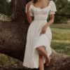 Bella Weißes Babydoll-Midi-Kleid mit Broderie Anglaise Bella Weißes Babydoll-Midi-Kleid mit Broderie Anglaise