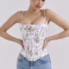 Cadie – Weißes Baumwoll-Korsetts-Oberteil mit Blumen- und Bändchenprint Cadie – Weißes Baumwoll-Korsetts-Oberteil mit Blumen- und Bändchenprint