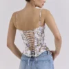 Cadie – Weißes Baumwoll-Korsetts-Oberteil mit Blumen- und Bändchenprint Cadie – Weißes Baumwoll-Korsetts-Oberteil mit Blumen- und Bändchenprint