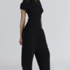 Caia Schwarzes Bouclé-Strick-Oberteil aus Wolle Caia Schwarzes Bouclé-Strick-Oberteil aus Wolle