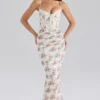 Calista Cremefarbenes Maxikleid aus Mesh mit Rosenprint Calista Cremefarbenes Maxikleid aus Mesh mit Rosenprint