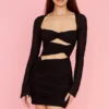 Camille – Schwarzes Minikleid aus echter Seide mit Cut-outs Camille – Schwarzes Minikleid aus echter Seide mit Cut-outs