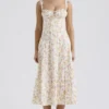 Carmen Elfenbeinfarbenes Baumwoll-Bustier-Sommerkleid mit Wiesenprint Carmen Elfenbeinfarbenes Baumwoll-Bustier-Sommerkleid mit Wiesenprint