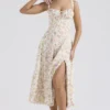 Carmen Elfenbeinfarbenes Baumwoll-Bustier-Sommerkleid mit Wiesenprint Carmen Elfenbeinfarbenes Baumwoll-Bustier-Sommerkleid mit Wiesenprint