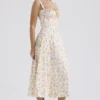 Carmen Elfenbeinfarbenes Baumwoll-Bustier-Sommerkleid mit Wiesenprint Carmen Elfenbeinfarbenes Baumwoll-Bustier-Sommerkleid mit Wiesenprint
