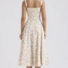Carmen Elfenbeinfarbenes Baumwoll-Bustier-Sommerkleid mit Wiesenprint Carmen Elfenbeinfarbenes Baumwoll-Bustier-Sommerkleid mit Wiesenprint