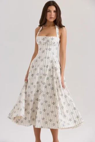 Claudia – cremefarbenes Midi-Kleid aus Stretch-Baumwolle mit Gänseblümchenprint und Neckholder-Ausschnitt