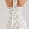 Claudia – cremefarbenes Midi-Kleid aus Stretch-Baumwolle mit Gänseblümchenprint und Neckholder-Ausschnitt Claudia – cremefarbenes Midi-Kleid aus Stretch-Baumwolle mit Gänseblümchenprint und Neckholder-Ausschnitt