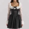 Cleora Schwarzes Minikleid mit Spitzenrüschen Cleora Schwarzes Minikleid mit Spitzenrüschen