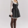 Cleora Schwarzes Minikleid mit Spitzenrüschen Cleora Schwarzes Minikleid mit Spitzenrüschen