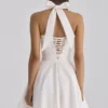 Cosette Weißes Minikleid mit Broderie Anglaise und Baumwoll-Halterausschnitt Cosette Weißes Minikleid mit Broderie Anglaise und Baumwoll-Halterausschnitt