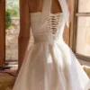 Cosette Weißes Minikleid mit Broderie Anglaise und Baumwoll-Halterausschnitt Cosette Weißes Minikleid mit Broderie Anglaise und Baumwoll-Halterausschnitt