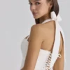 Cosette Weißes Minikleid mit Broderie Anglaise und Baumwoll-Halterausschnitt Cosette Weißes Minikleid mit Broderie Anglaise und Baumwoll-Halterausschnitt