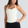 Das Peekaboo Ivory Neckholder-Korsetts-Oberteil Das Peekaboo Ivory Neckholder-Korsetts-Oberteil