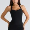 Das schwarze Peekaboo-Halter-Korsetts-Oberteil Das schwarze Peekaboo-Halter-Korsetts-Oberteil