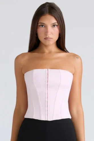 Das trägerlose rosa Stretch-Korsetts-Oberteil