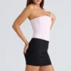Das trägerlose rosa Stretch-Korsetts-Oberteil Das trägerlose rosa Stretch-Korsetts-Oberteil