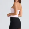 Das trägerlose rosa Stretch-Korsetts-Oberteil Das trägerlose rosa Stretch-Korsetts-Oberteil
