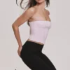 Das trägerlose rosa Stretch-Korsetts-Oberteil Das trägerlose rosa Stretch-Korsetts-Oberteil