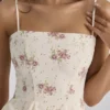 Dolly Elfenbeinfarbenes Vintage-Mini-Sommerkleid aus Baumwolle mit Rosenprint Dolly Elfenbeinfarbenes Vintage-Mini-Sommerkleid aus Baumwolle mit Rosenprint
