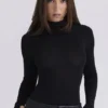Eliena Schwarzer Bodys mit hohem Kragen und langen Ärmeln Eliena Schwarzer Bodys mit hohem Kragen und langen Ärmeln