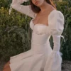 Ellerie Weißes Minikleid aus Baumwolle mit Flötenärmeln Ellerie Weißes Minikleid aus Baumwolle mit Flötenärmeln