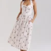 Emilia Cremefarbenes Midi-Kleid aus Stretch-Baumwolle mit Blumenprint und Neckholder-Ausschnitt Emilia Cremefarbenes Midi-Kleid aus Stretch-Baumwolle mit Blumenprint und Neckholder-Ausschnitt