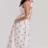 Emilia Cremefarbenes Midi-Kleid aus Stretch-Baumwolle mit Blumenprint und Neckholder-Ausschnitt Emilia Cremefarbenes Midi-Kleid aus Stretch-Baumwolle mit Blumenprint und Neckholder-Ausschnitt