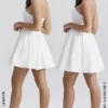 Emmanuela Weißes, trägerloses, plissiertes Minikleid Emmanuela Weißes, trägerloses, plissiertes Minikleid