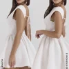Enchant Weißes Minikleid mit offenem Rücken Enchant Weißes Minikleid mit offenem Rücken
