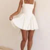 Florianne Elfenbeinfarbenes Baumwoll-Minikleid mit Schleife Florianne Elfenbeinfarbenes Baumwoll-Minikleid mit Schleife