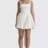 Florianne Elfenbeinfarbenes Baumwoll-Minikleid mit Schleife Florianne Elfenbeinfarbenes Baumwoll-Minikleid mit Schleife