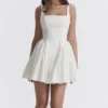 Florianne Elfenbeinfarbenes Baumwoll-Minikleid mit Schleife Florianne Elfenbeinfarbenes Baumwoll-Minikleid mit Schleife