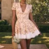 Imani Mini-Kleid aus plissierter Baumwolle mit Honeyflower-Print Imani Mini-Kleid aus plissierter Baumwolle mit Honeyflower-Print