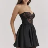 Jadore – Schwarzes, trägerloses Minikleid aus Spitze und Satin Jadore – Schwarzes, trägerloses Minikleid aus Spitze und Satin