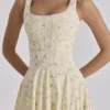Jaime Midi-Sommerkleid aus Baumwolle mit Blumenprint in Zitronengelb und Schnürung Jaime Midi-Sommerkleid aus Baumwolle mit Blumenprint in Zitronengelb und Schnürung