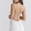 Joan Elfenbeinfarbenes Maxikleid mit Schnürung am Rücken Joan Elfenbeinfarbenes Maxikleid mit Schnürung am Rücken