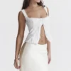 Juana Weißes Oberteil mit Broderie Anglaise Juana Weißes Oberteil mit Broderie Anglaise