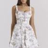 Kimmie Weißes Baumwoll-Minikleid mit Blumenband-Print Kimmie Weißes Baumwoll-Minikleid mit Blumenband-Print