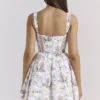 Kimmie Weißes Baumwoll-Minikleid mit Blumenband-Print Kimmie Weißes Baumwoll-Minikleid mit Blumenband-Print