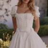 Lili Weißes Baumwoll-Minikleid mit abnehmbarem Korsett Lili Weißes Baumwoll-Minikleid mit abnehmbarem Korsett