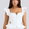 Lilibet Weißes besticktes Peplum-Korsetts-Oberteil aus Baumwolle Lilibet Weißes besticktes Peplum-Korsetts-Oberteil aus Baumwolle