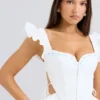 Lilibet Weißes besticktes Peplum-Korsetts-Oberteil aus Baumwolle Lilibet Weißes besticktes Peplum-Korsetts-Oberteil aus Baumwolle