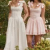 Lillia Weißes Midi-Kleid aus Stretch-Baumwolle mit Schleifen Lillia Weißes Midi-Kleid aus Stretch-Baumwolle mit Schleifen